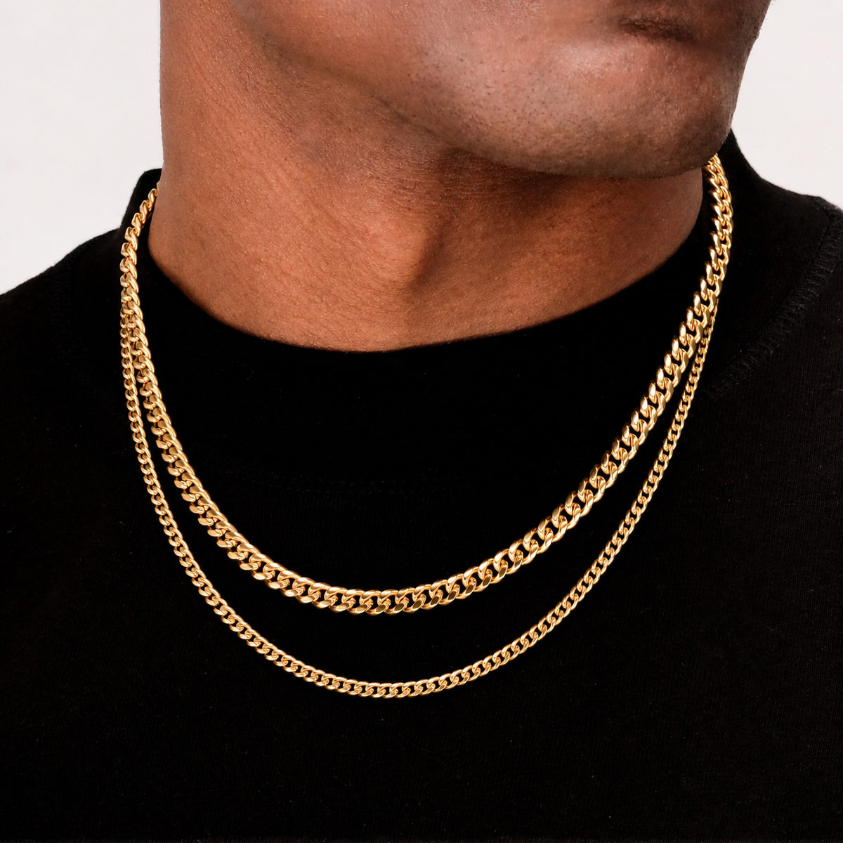 VOLT gold Cuban chains in two widths worn together